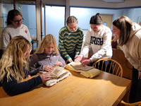 dcterms:description: Students examining two medieval manuscripts housed in Saint Mary's collection

iptc:By-line: Sarah Noonan

dcterms:date: April 23, 2023